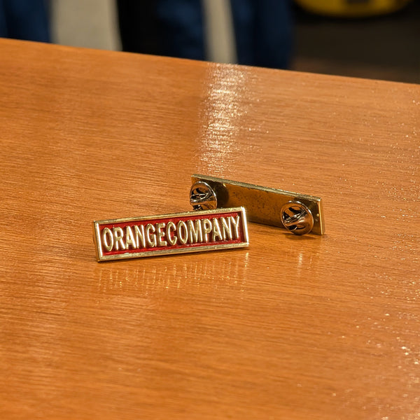 ORANGE COMPANY PIN BADGE