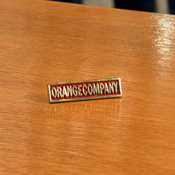 ORANGE COMPANY PIN BADGE